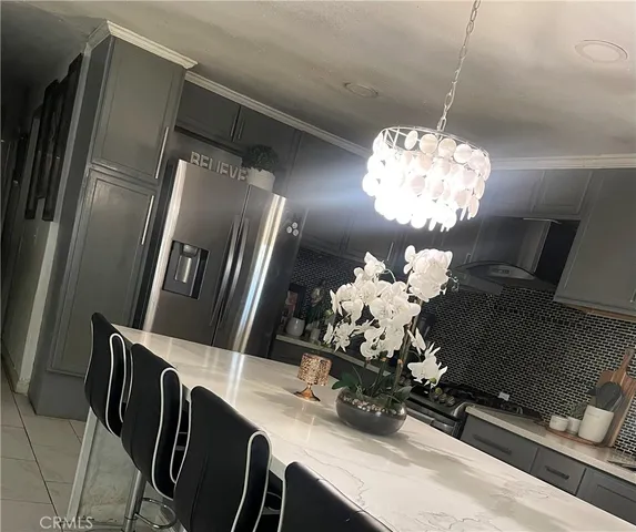 a room with a chandelier and living room view