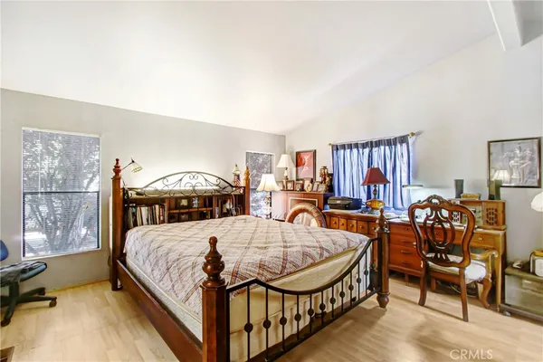 a bed room with furniture and a window
