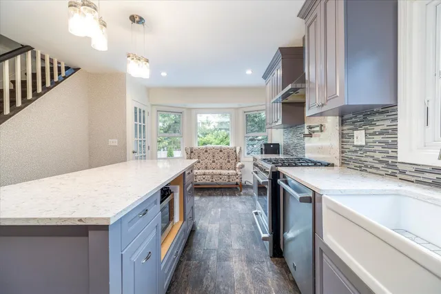 a kitchen with a stove and a sink