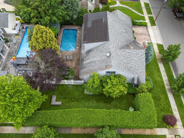 a aerial view of a house with a yard