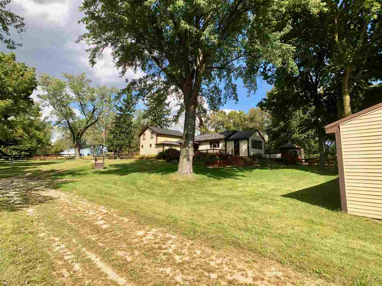 6038 Tipple Road Rockford, IL 61102 - Photo 25 of 25 a view of yard with swimming pool and trees