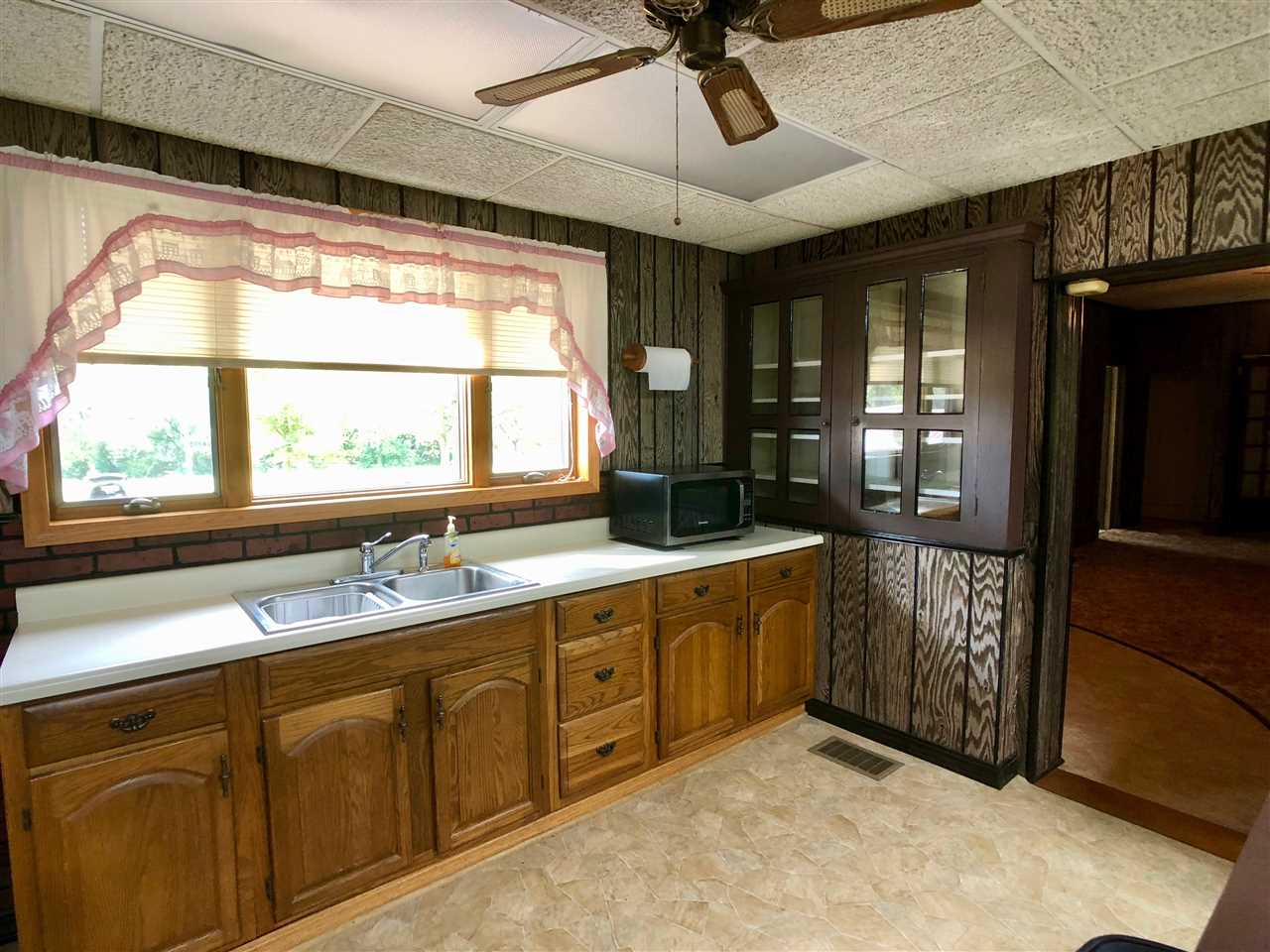 6038 Tipple Road Rockford, IL 61102 - Photo 5 of 25 a bathroom with a sink and a large mirror