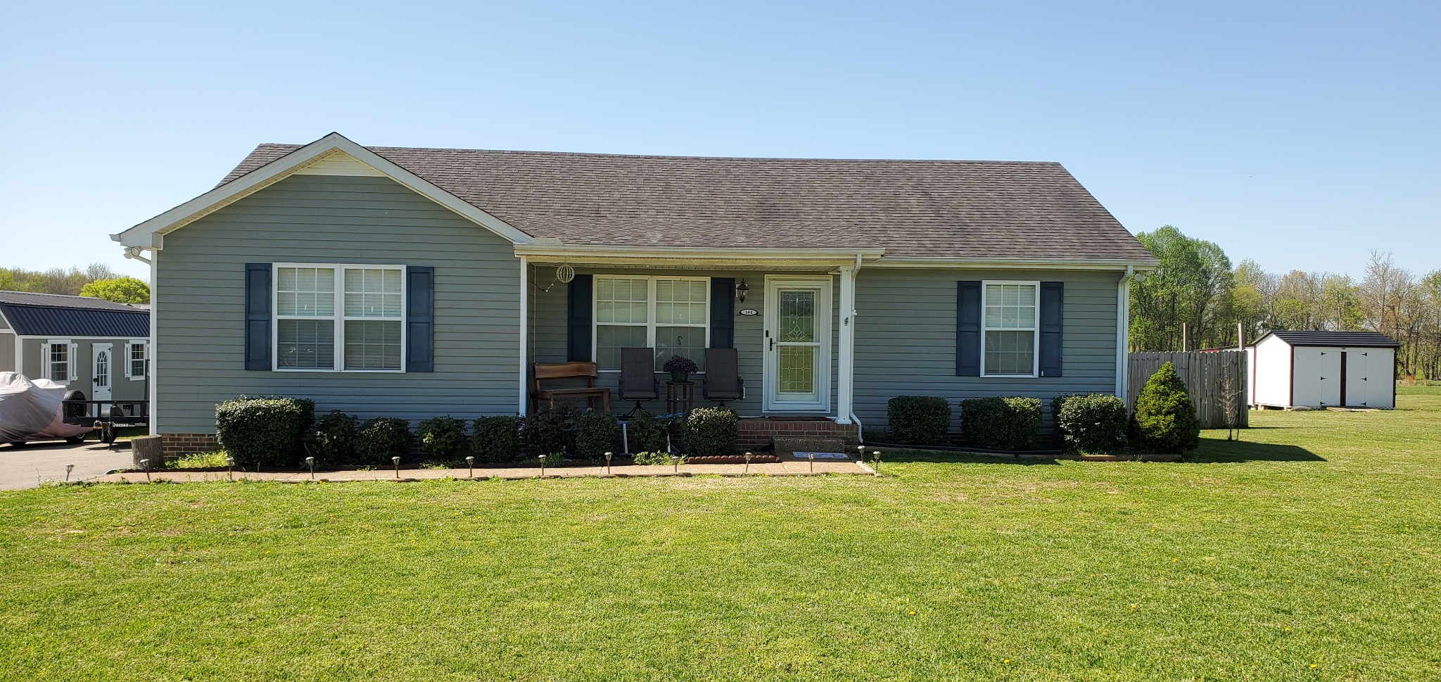 a front view of a house with a yard
