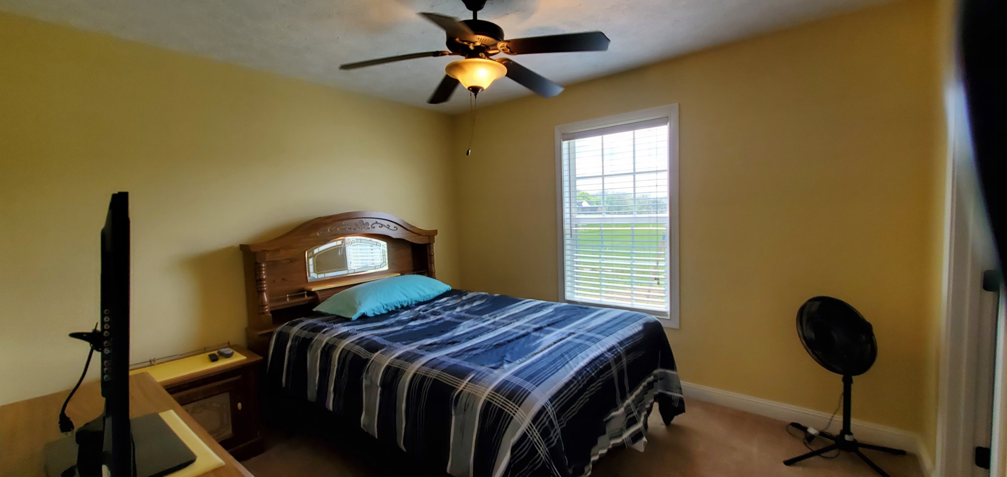 140 T G T Road Portland, TN 37148 - Photo 12 of 13 a bedroom with a bed and a chandelier