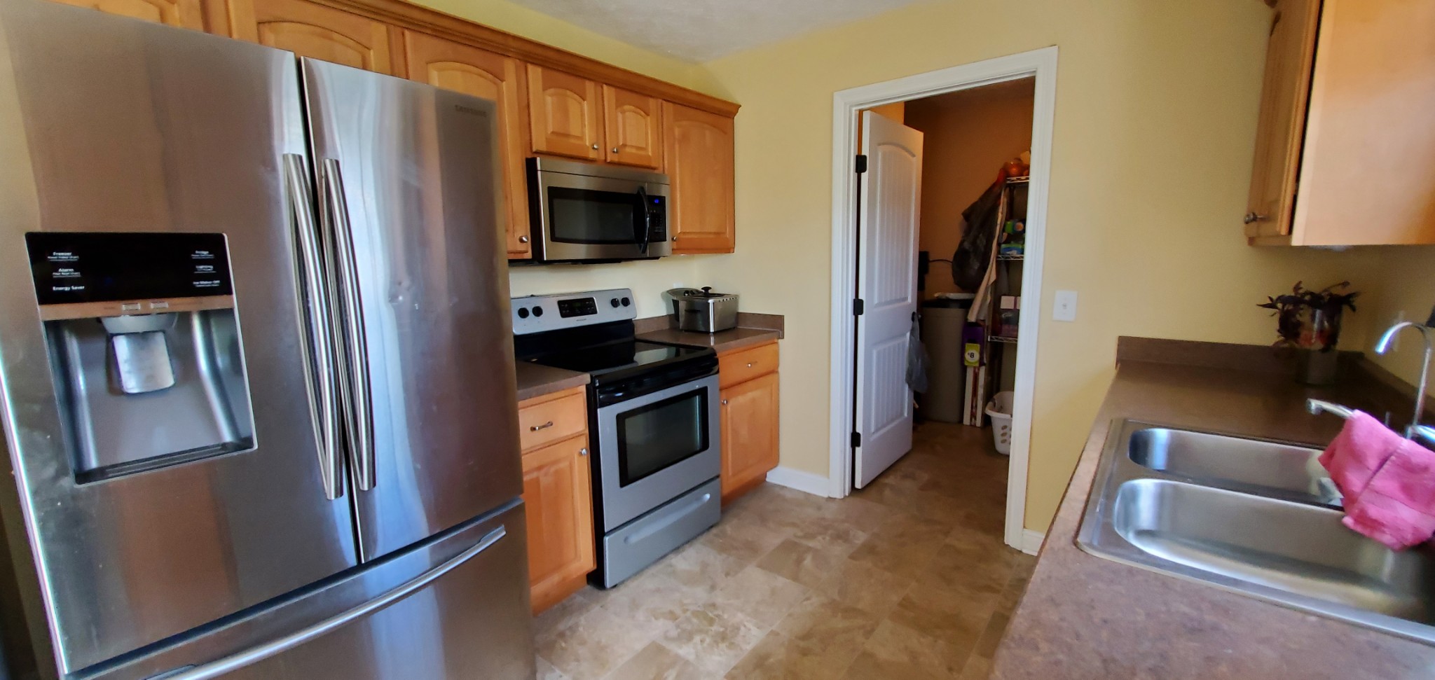 140 T G T Road Portland, TN 37148 - Photo 4 of 13 a kitchen with stainless steel appliances a refrigerator stove and microwave