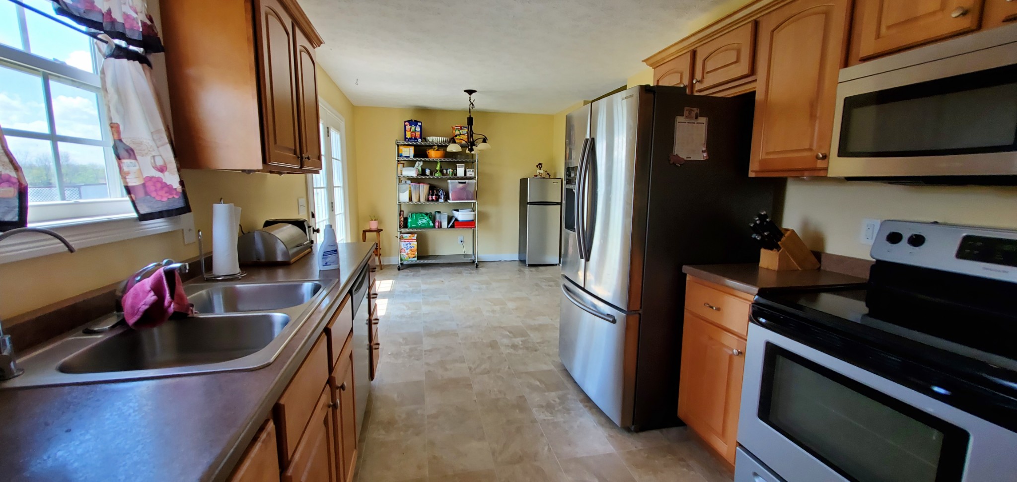 140 T G T Road Portland, TN 37148 - Photo 5 of 13 a kitchen with stainless steel appliances a sink stove and refrigerator
