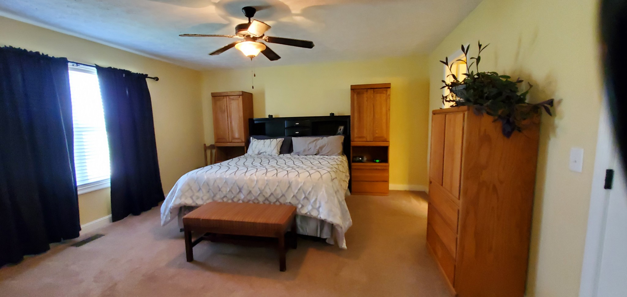 140 T G T Road Portland, TN 37148 - Photo 7 of 13 a bedroom with a bed and a chandelier