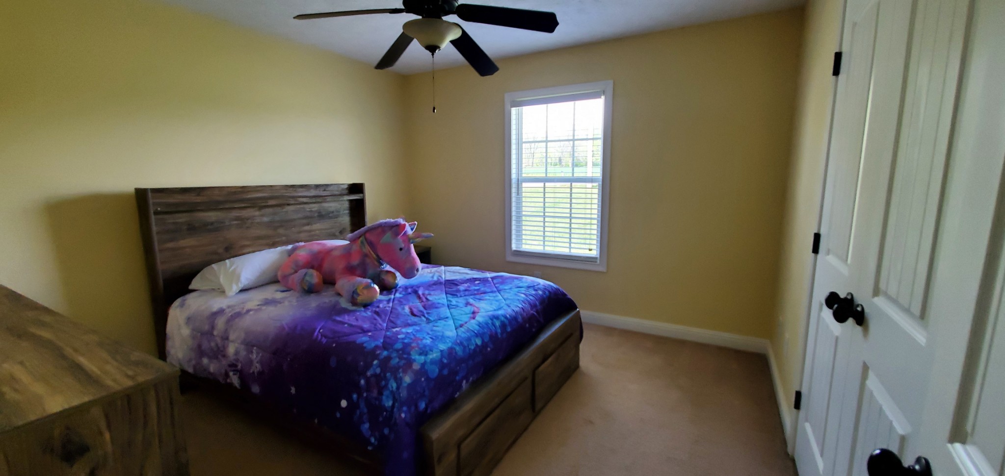 140 T G T Road Portland, TN 37148 - Photo 10 of 13 a bed sitting in a bedroom next to a window