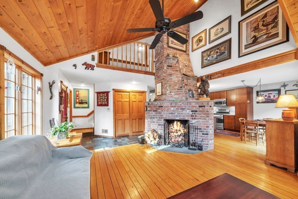 1 St Germain Road Hampden, MA 01036 - Photo 11 of 42 a living room with furniture a fireplace and a large window
