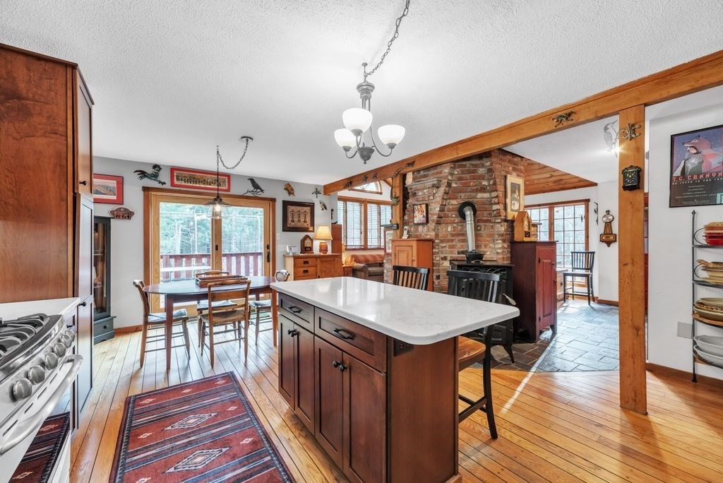 1 St Germain Road Hampden, MA 01036 - Photo 17 of 42 a large kitchen with a table and chairs