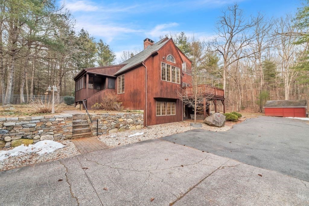 1 St Germain Road Hampden, MA 01036 - Photo 4 of 42 a front view of a house with a yard