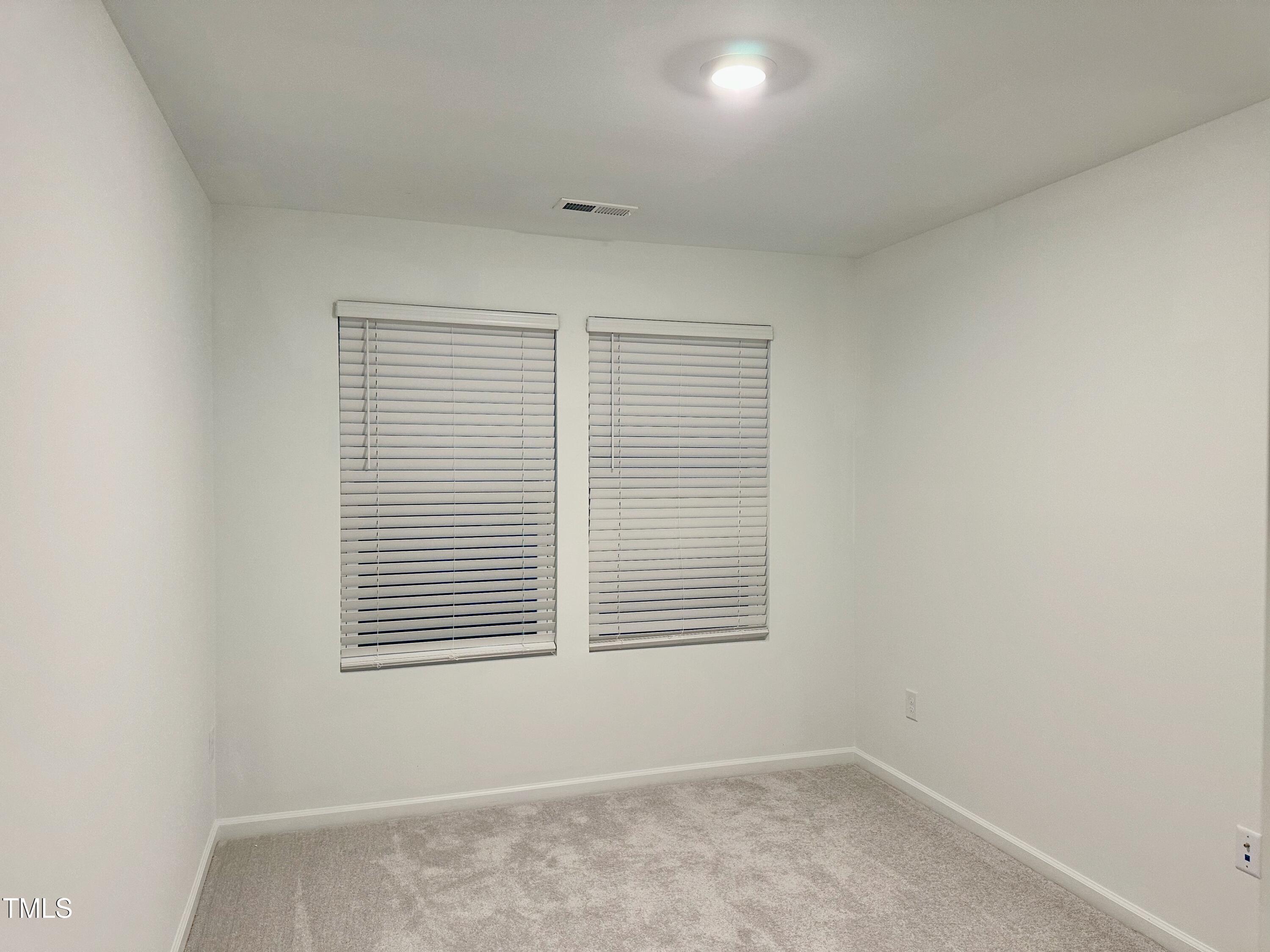 3008 Vitner Drive Durham, NC 27704 - Photo 11 of 17 an empty room with a window