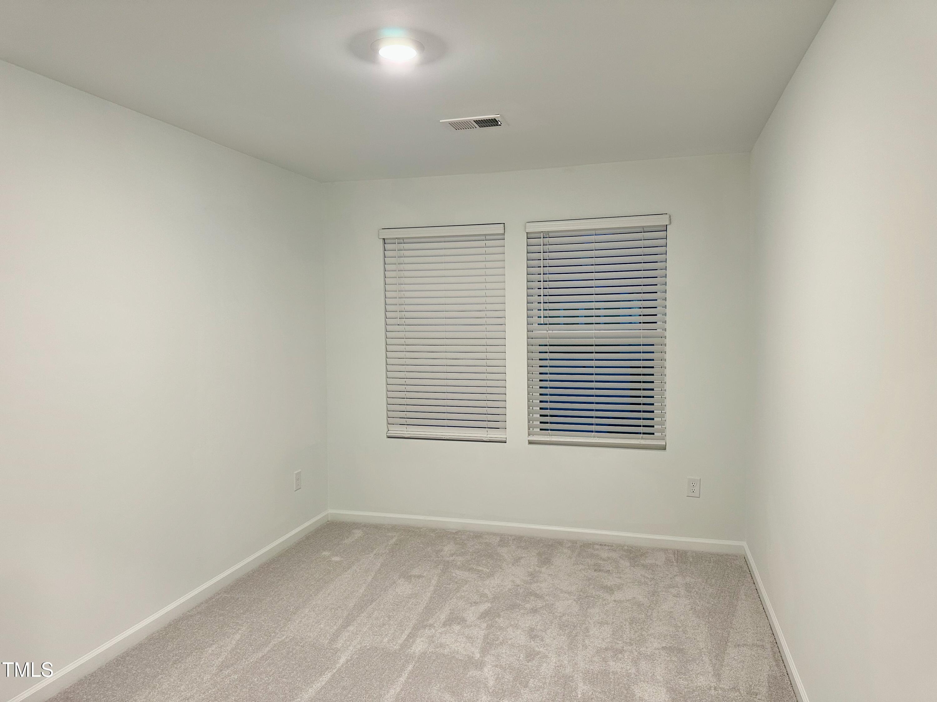 3008 Vitner Drive Durham, NC 27704 - Photo 17 of 17 an empty room with a window