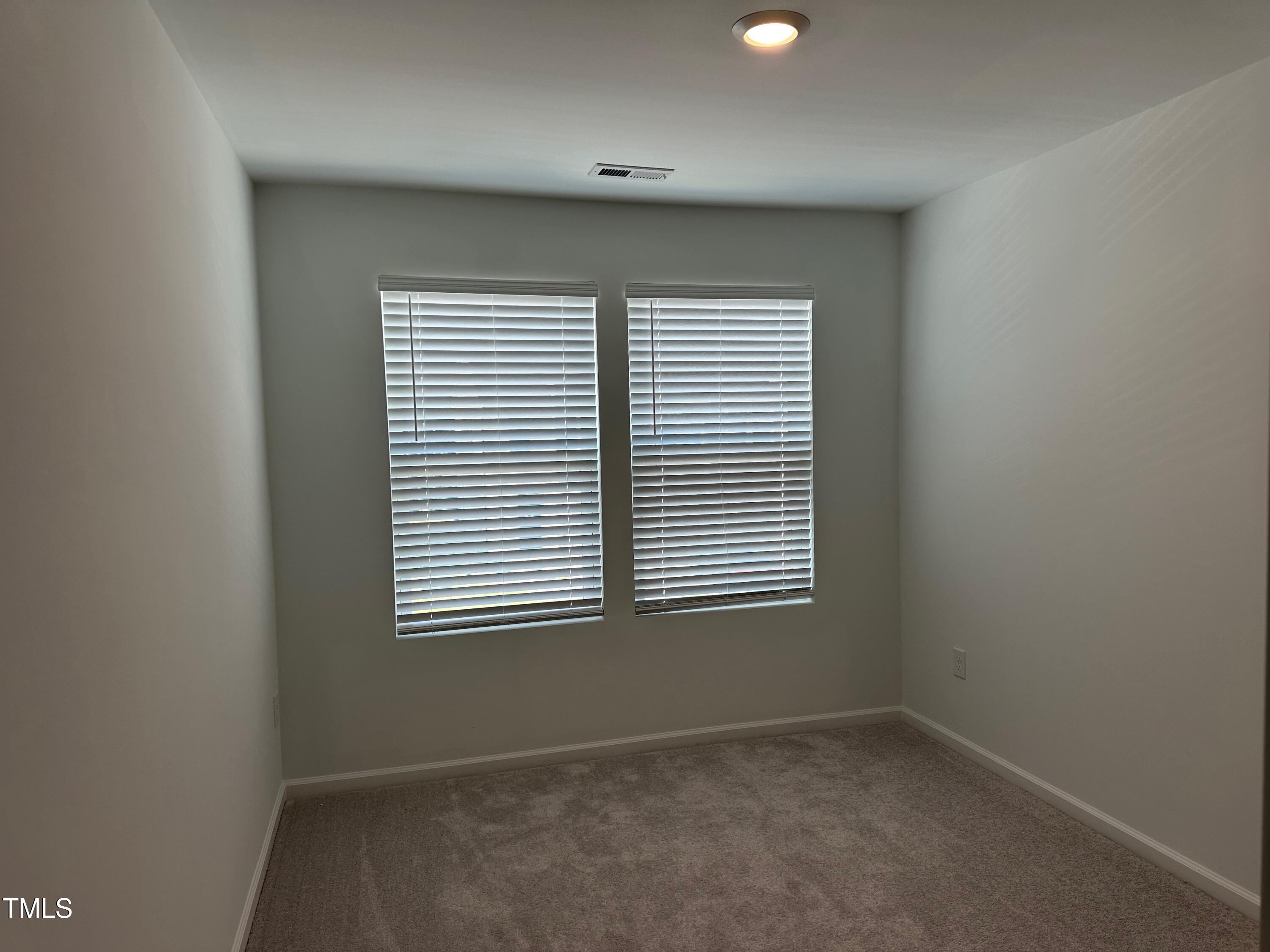 3008 Vitner Drive Durham, NC 27704 - Photo 10 of 17 an empty room with a window