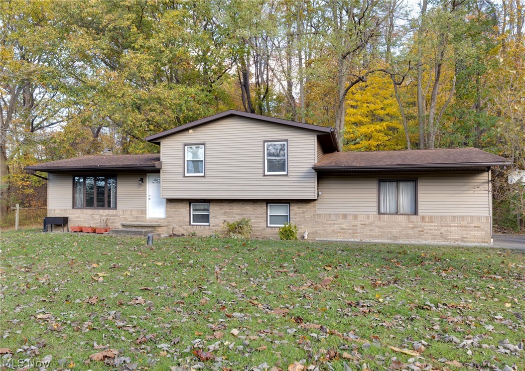 9416 Kieffer Road Mantua, OH 44255 - Photo 2 of 29 View of front of home featuring a front yard and brick siding