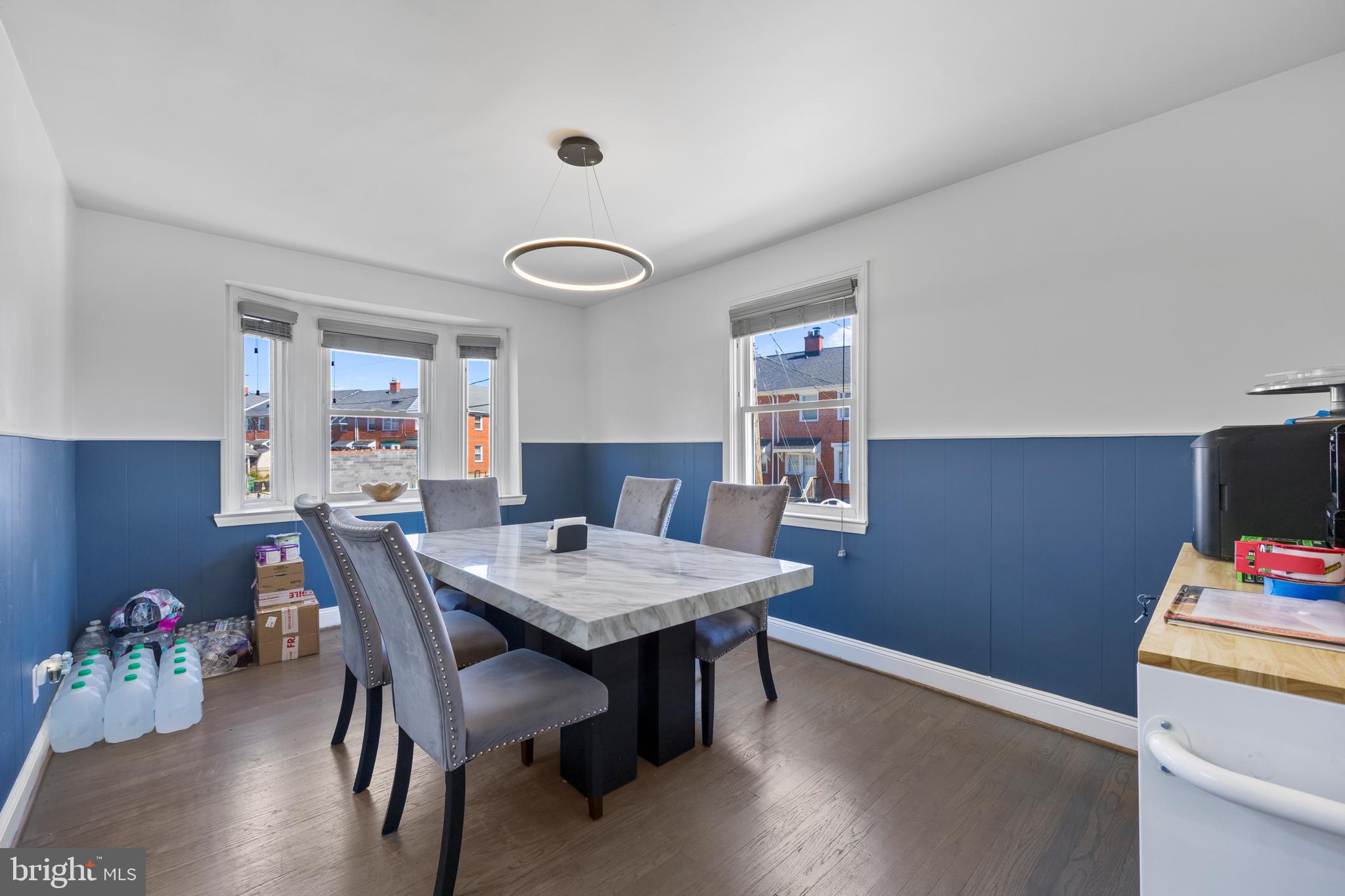 4511 Marble Hall Road Baltimore, MD 21239 - Photo 12 of 48 a view of a dining room with furniture and wooden floor