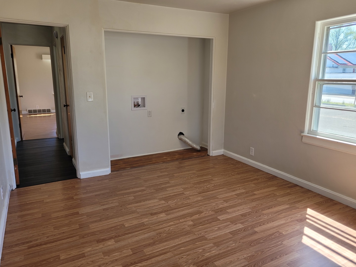 507 North 12th Street Mount Vernon, IL 62864 - Photo 15 of 23 a view of an empty room with wooden floor and a window