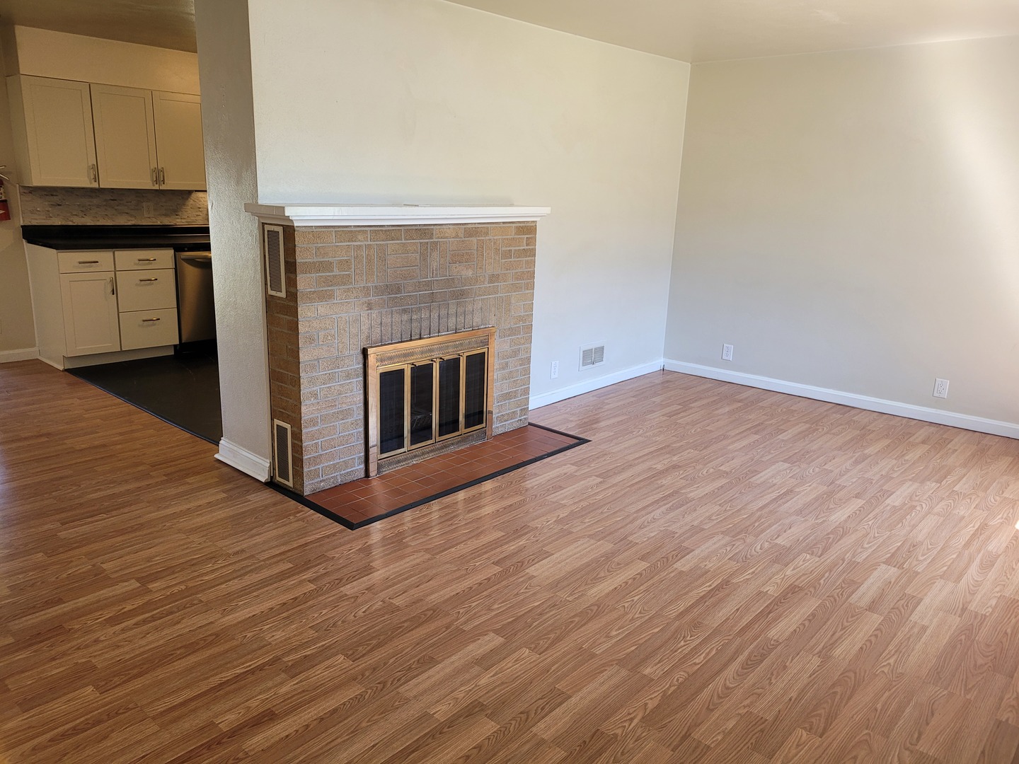 507 North 12th Street Mount Vernon, IL 62864 - Photo 7 of 23 a view of a hallway with wooden floor and a fireplace