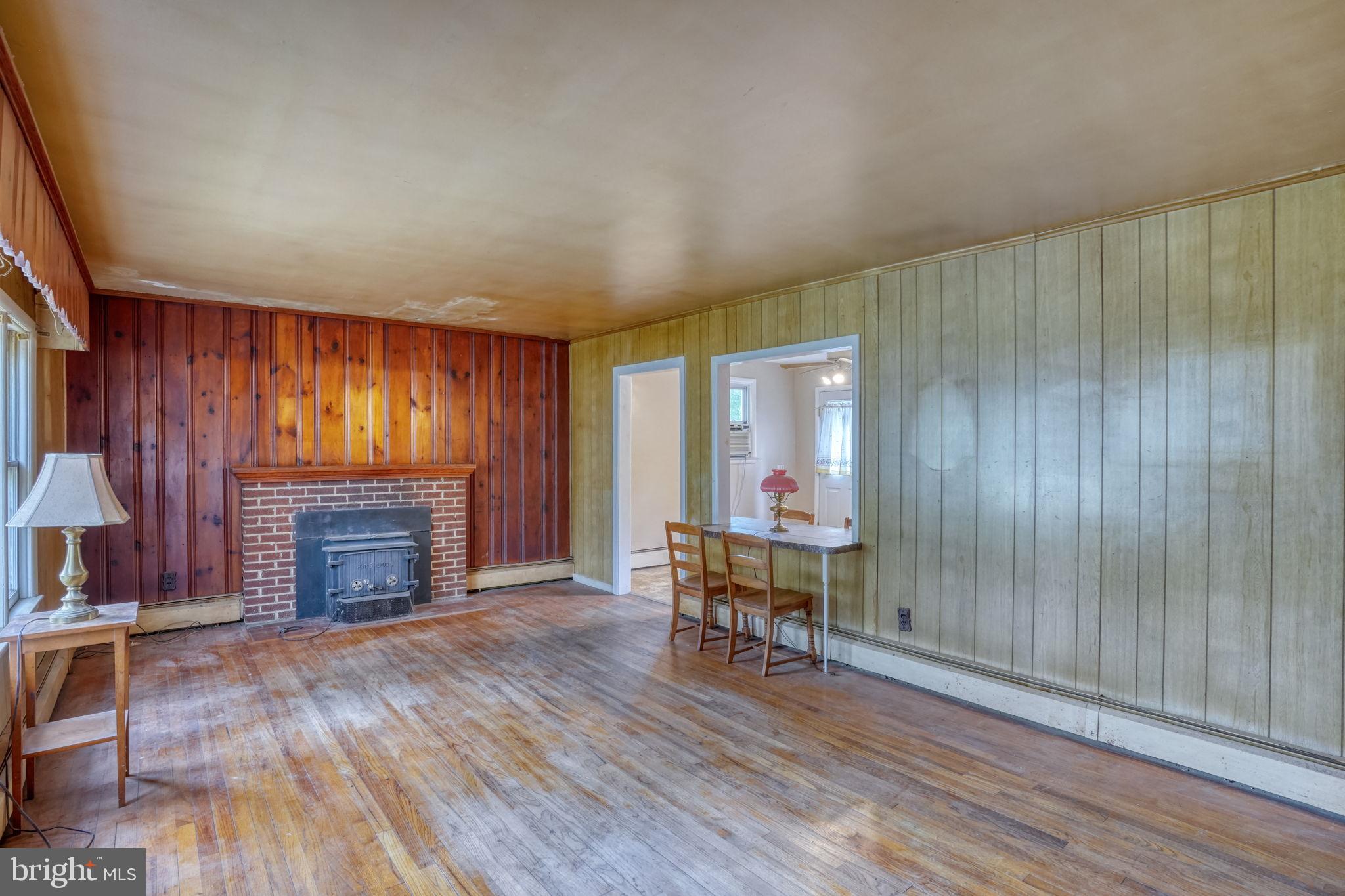 2927 Frazer Road Newark, DE 19702 - Photo 21 of 43 an empty room with furniture fireplace and wooden floor