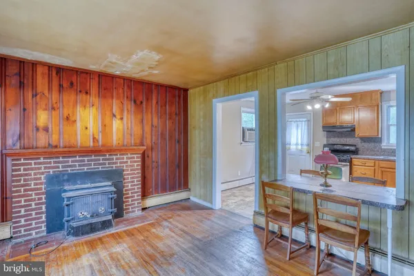 a kitchen with cabinets appliances and a window