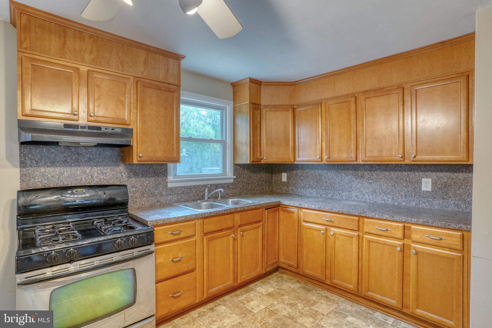 2927 Frazer Road Newark, DE 19702 - Photo 24 of 43 a kitchen with cabinets appliances and a window