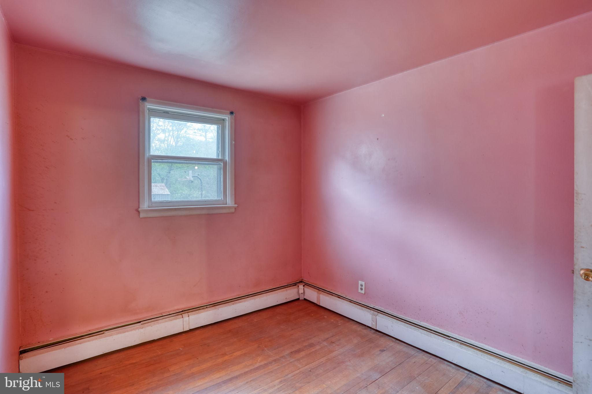2927 Frazer Road Newark, DE 19702 - Photo 29 of 43 a view of an empty room with wooden floor and a window