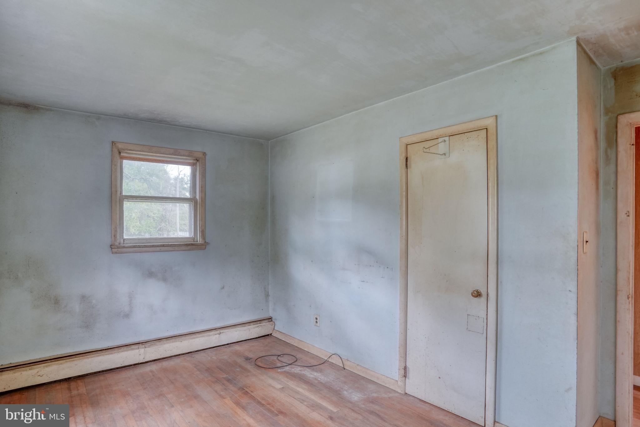 2927 Frazer Road Newark, DE 19702 - Photo 35 of 43 an empty room with wooden floor and windows
