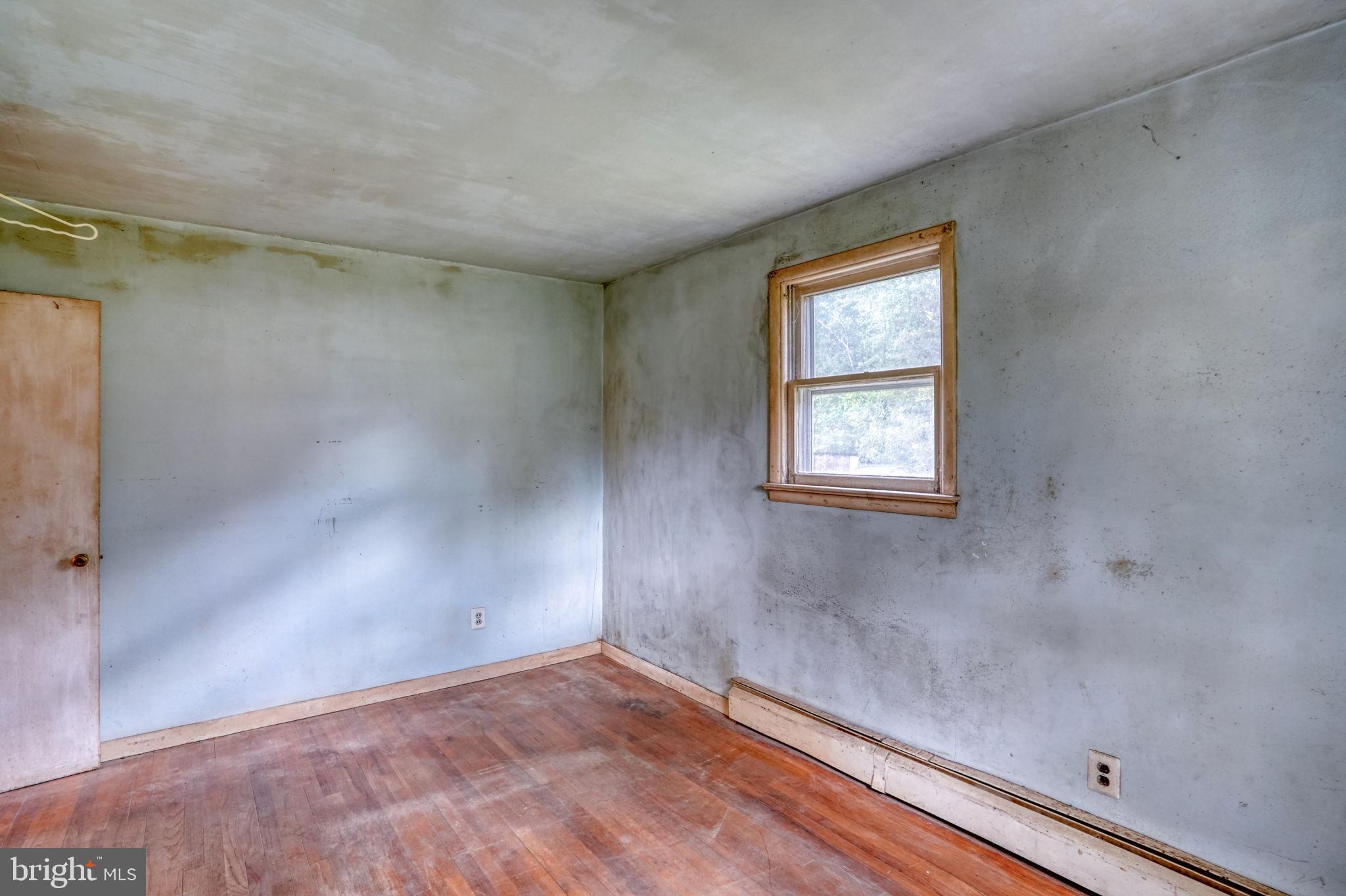 2927 Frazer Road Newark, DE 19702 - Photo 36 of 43 a view of an empty room with a window and wooden floor