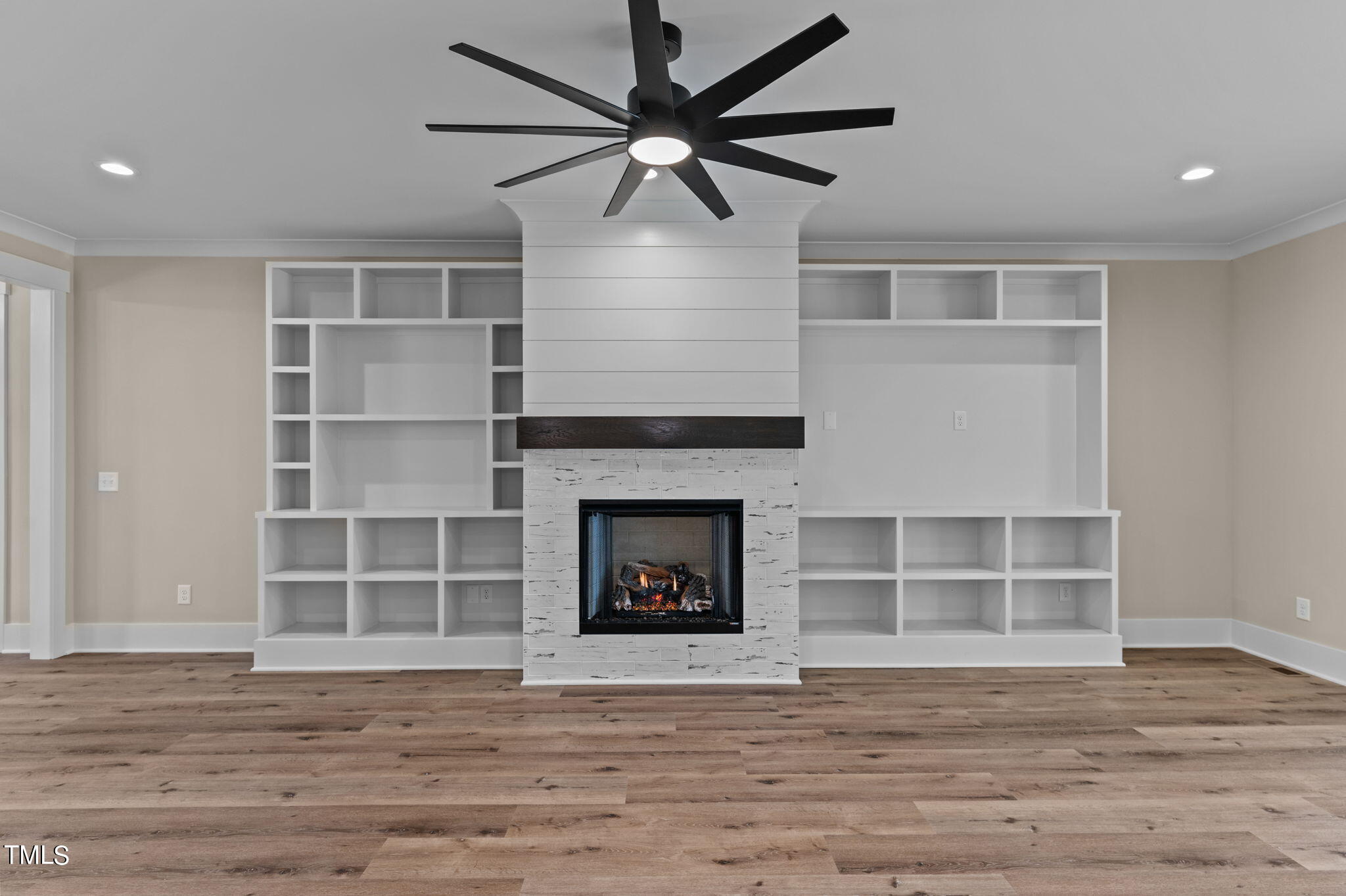 3816 Old Milburnie Road Raleigh, NC 27616 - Photo 14 of 58 a view of a livingroom with a fireplace and wooden floor