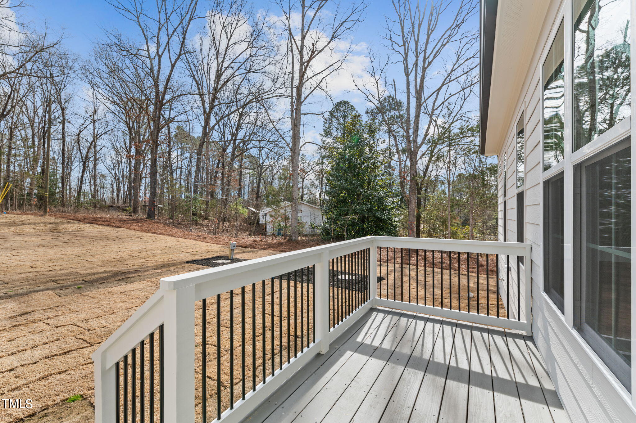 3816 Old Milburnie Road Raleigh, NC 27616 - Photo 18 of 58 a view of a wooden deck with a trees