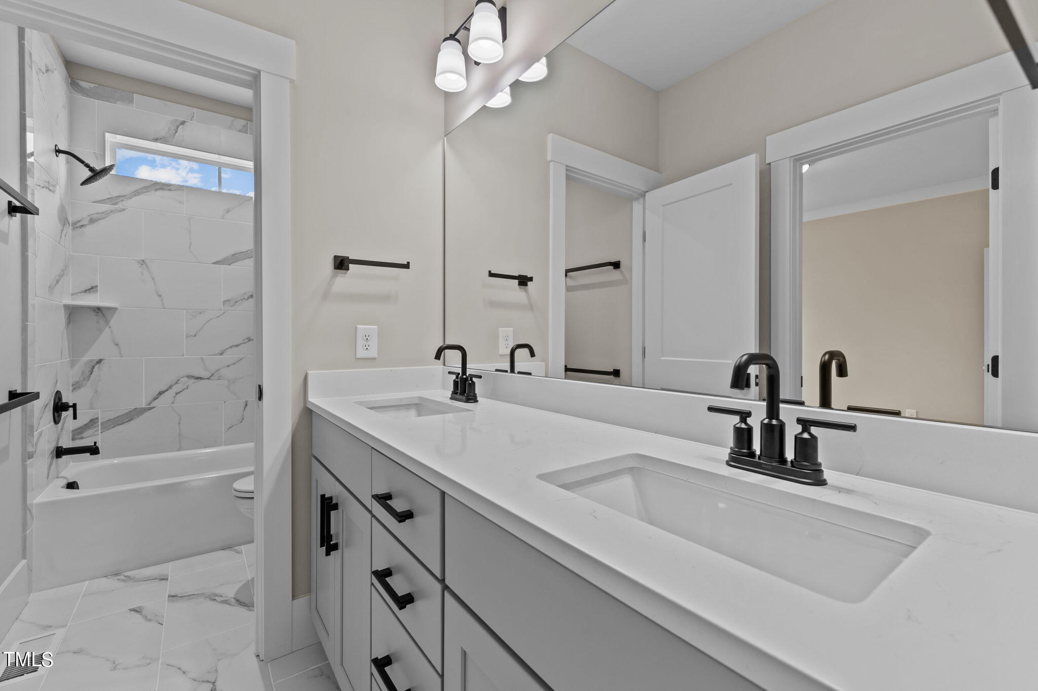 3816 Old Milburnie Road Raleigh, NC 27616 - Photo 23 of 58 a bathroom with a sink a tub and a mirror