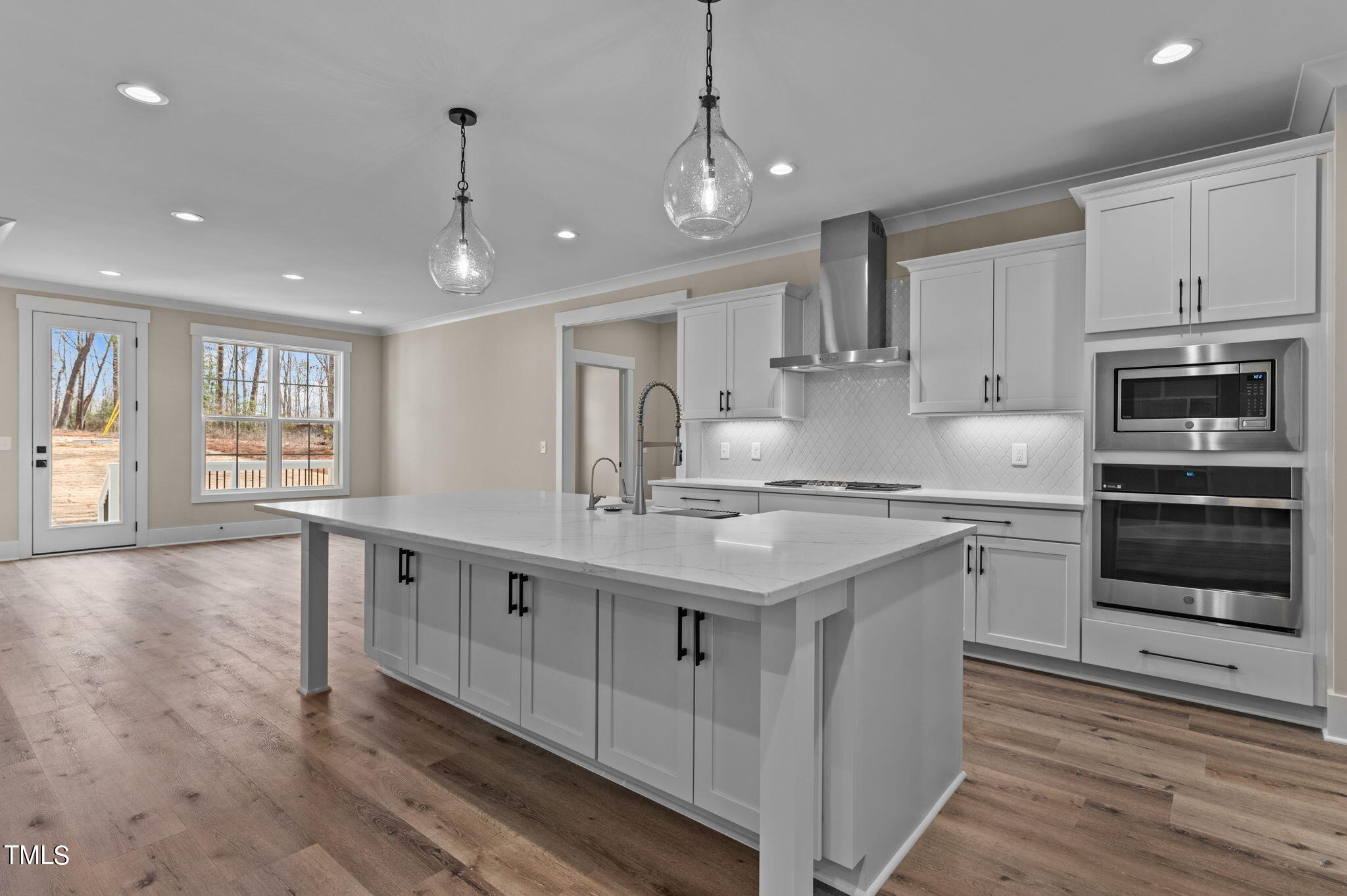 3816 Old Milburnie Road Raleigh, NC 27616 - Photo 27 of 58 a kitchen with stainless steel appliances granite countertop a sink stove oven and refrigerator