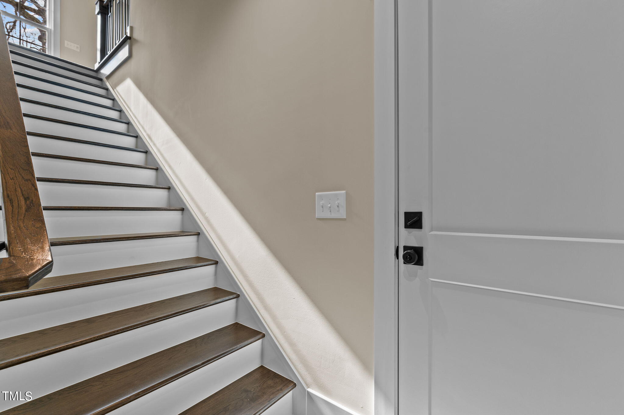 3816 Old Milburnie Road Raleigh, NC 27616 - Photo 35 of 58 a view of staircase with wooden floor and white walls
