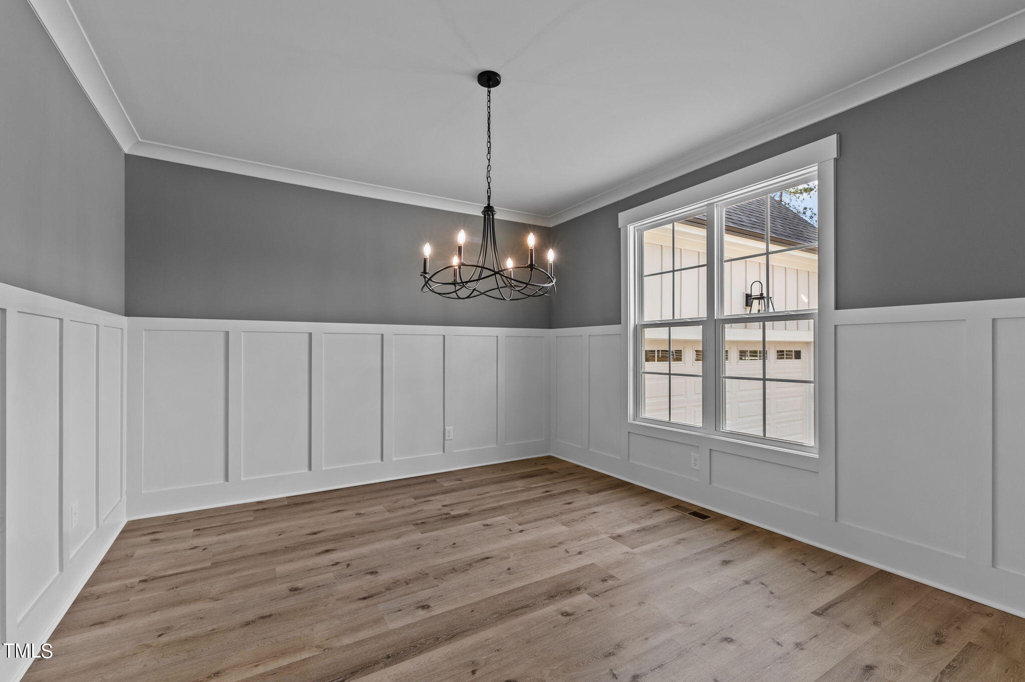 3816 Old Milburnie Road Raleigh, NC 27616 - Photo 43 of 58 a view of an empty room with wooden floor and a window