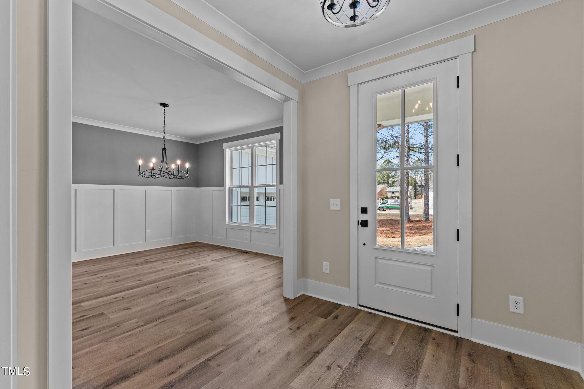3816 Old Milburnie Road Raleigh, NC 27616 - Photo 44 of 58 an empty room with wooden floor cabinet and windows