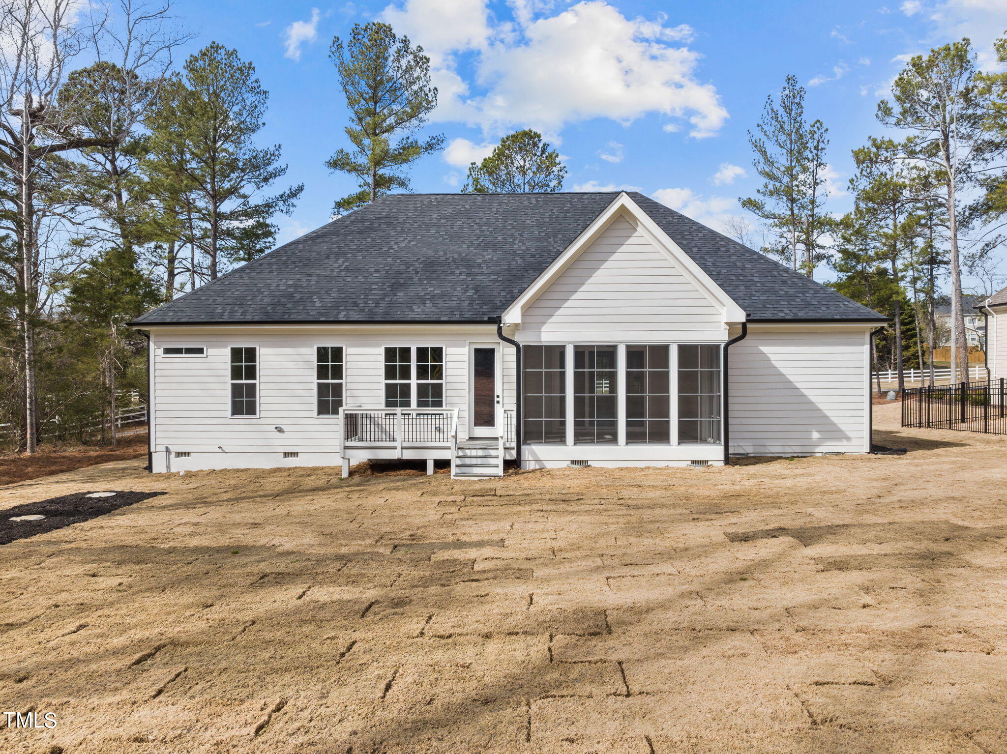 3816 Old Milburnie Road Raleigh, NC 27616 - Photo 48 of 58 a front view of a house with a garden and trees