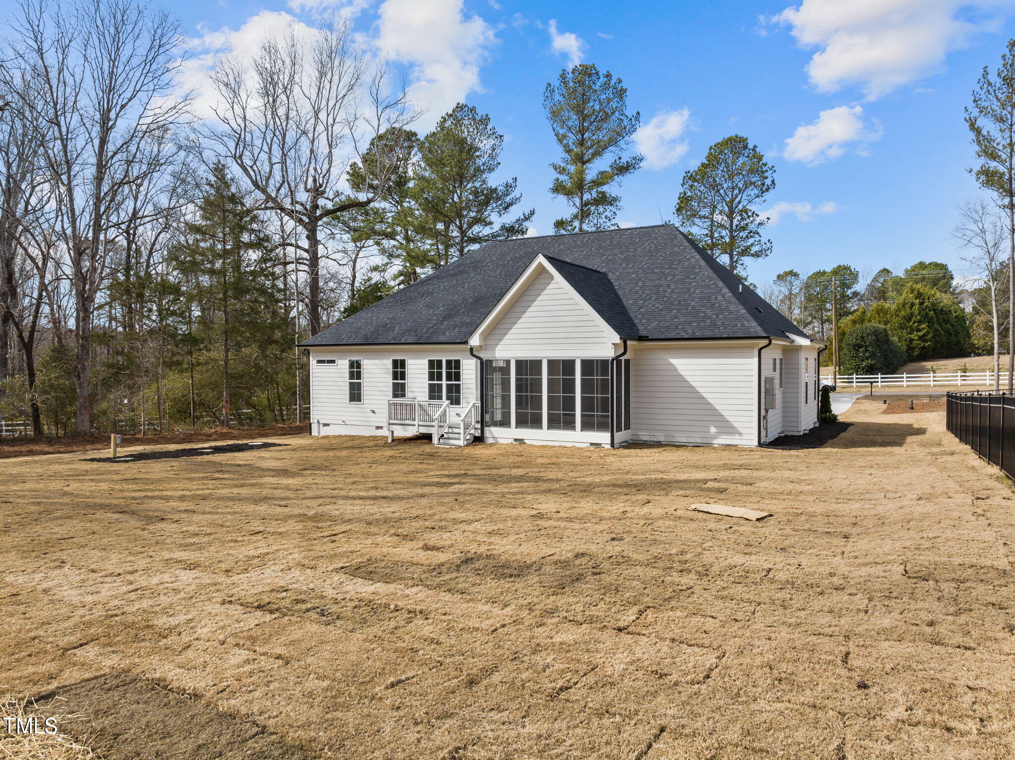 3816 Old Milburnie Road Raleigh, NC 27616 - Photo 49 of 58 a front view of a house with a garden