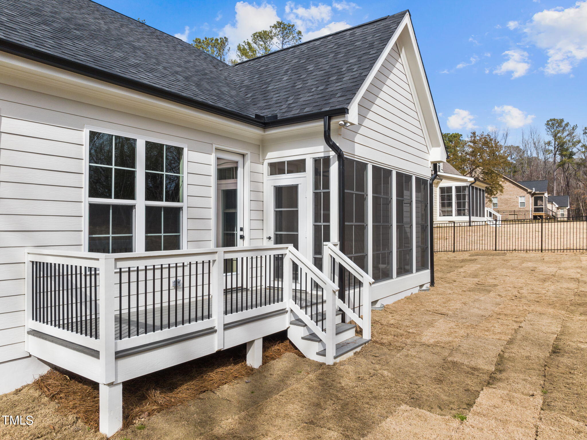 3816 Old Milburnie Road Raleigh, NC 27616 - Photo 53 of 58 a view of a house with a small yard and wooden deck