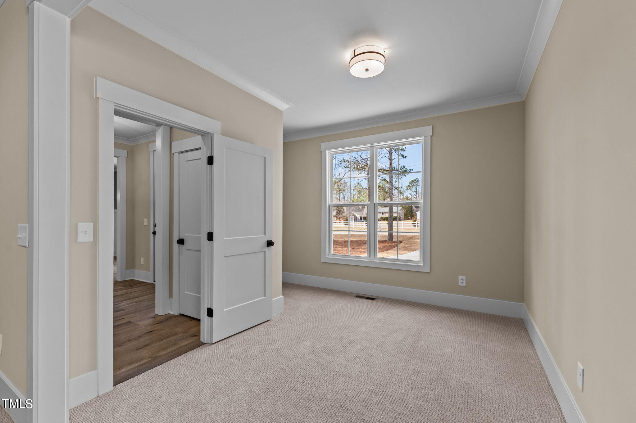 3816 Old Milburnie Road Raleigh, NC 27616 - Photo 6 of 58 a view of an empty room with a window