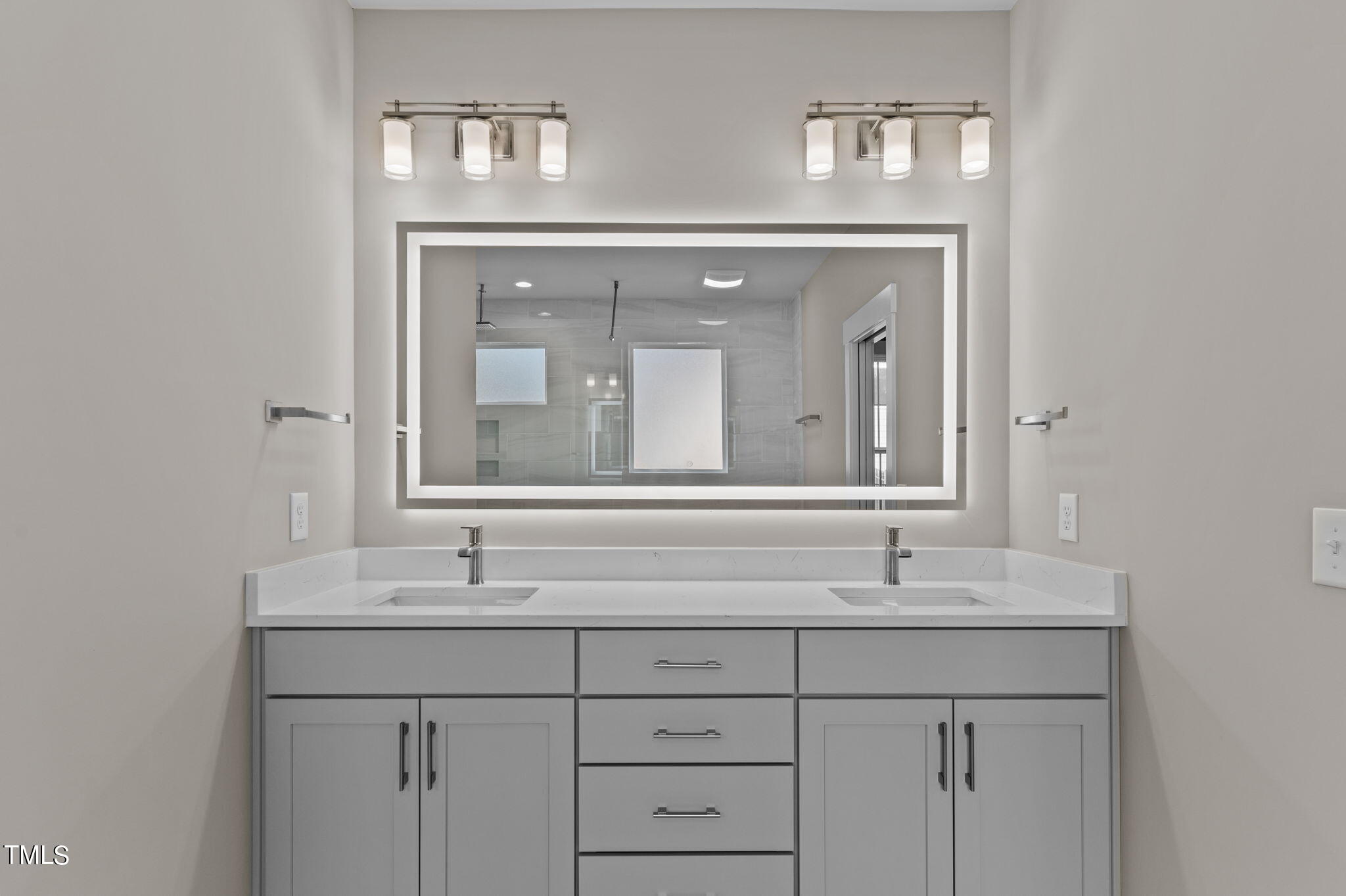 3816 Old Milburnie Road Raleigh, NC 27616 - Photo 9 of 58 a bathroom with a sink and two mirror