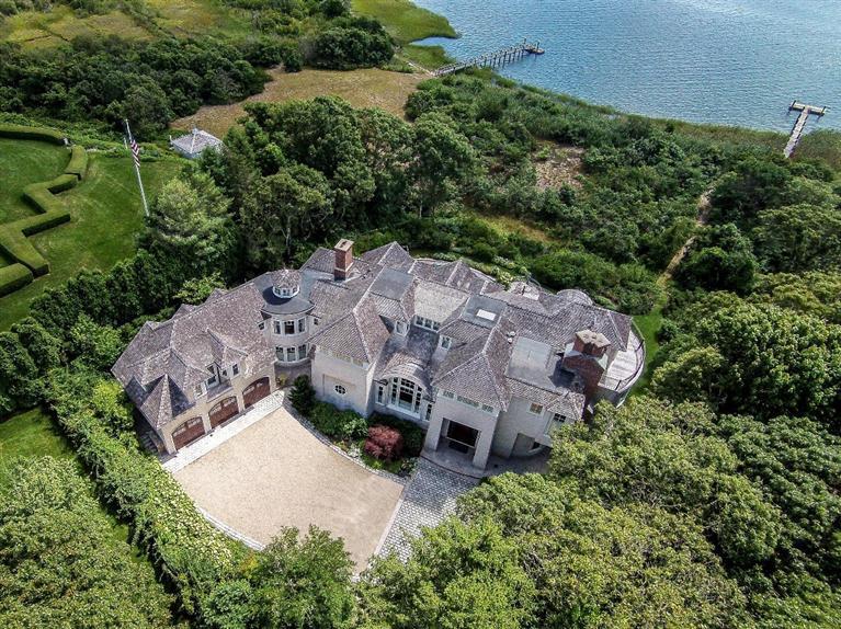 an aerial view of houses with yard