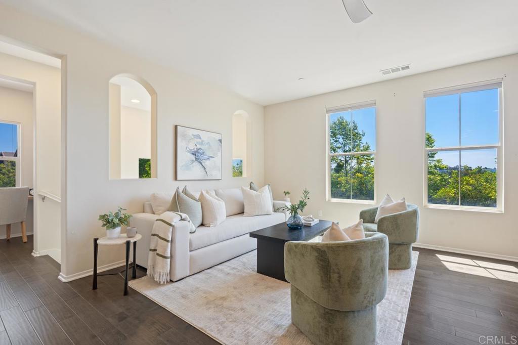 6610 Canopy Ridge Lane, Unit 37 San Diego, CA 92121 - Photo 13 of 65 a living room with furniture and a large window