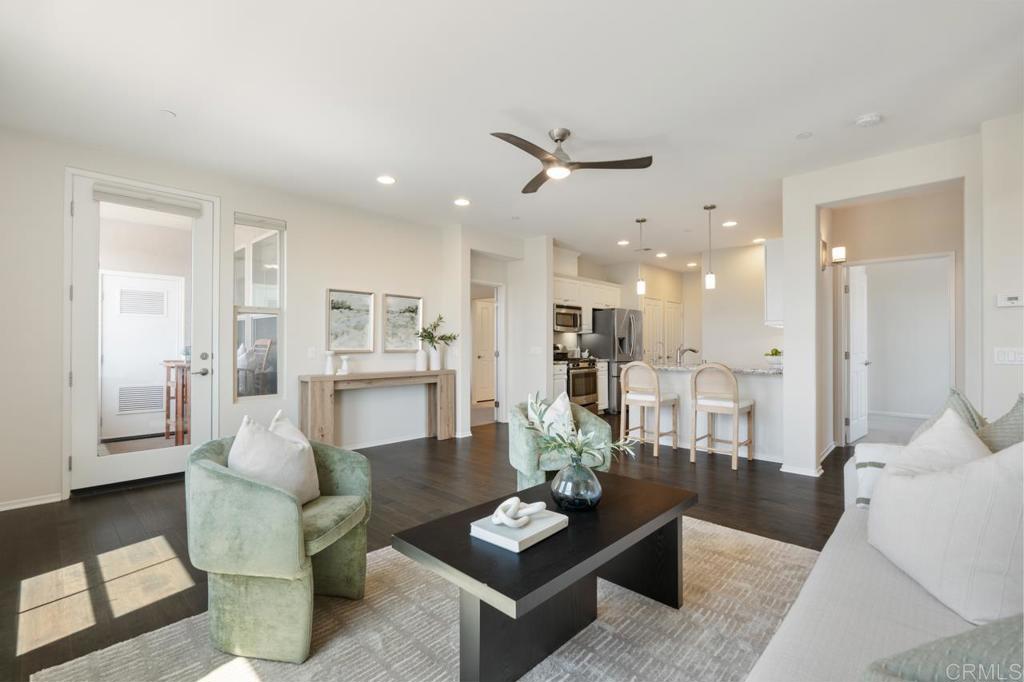 6610 Canopy Ridge Lane, Unit 37 San Diego, CA 92121 - Photo 16 of 65 a living room with furniture and a view of kitchen