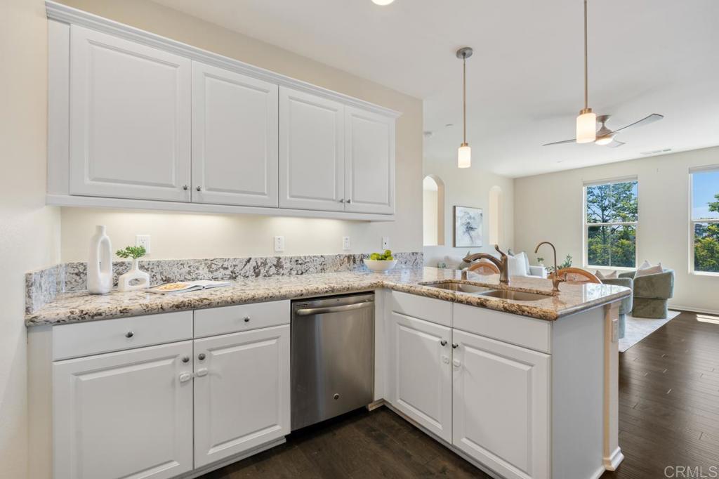 6610 Canopy Ridge Lane, Unit 37 San Diego, CA 92121 - Photo 27 of 65 a kitchen with white cabinets and white appliances