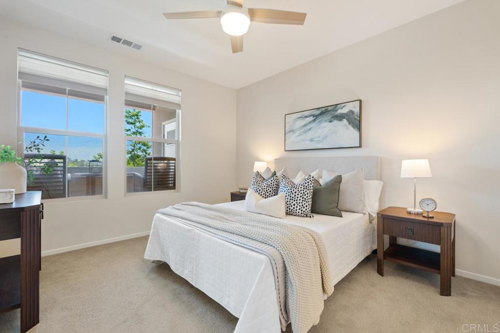 6610 Canopy Ridge Lane, Unit 37 San Diego, CA 92121 - Photo 31 of 65 a bedroom with bed and a large window