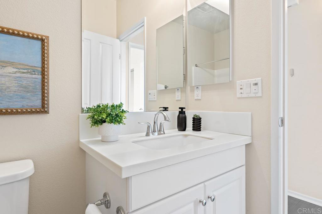 6610 Canopy Ridge Lane, Unit 37 San Diego, CA 92121 - Photo 41 of 65 a bathroom with a sink and a mirror