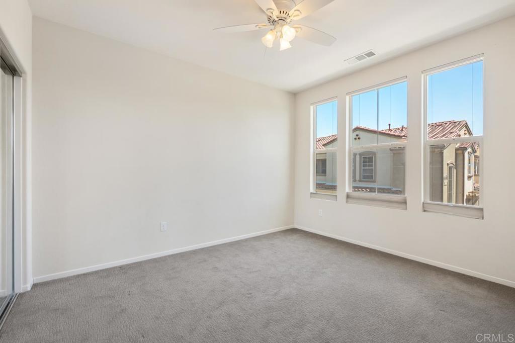 6610 Canopy Ridge Lane, Unit 37 San Diego, CA 92121 - Photo 42 of 65 a view of an empty room with a window