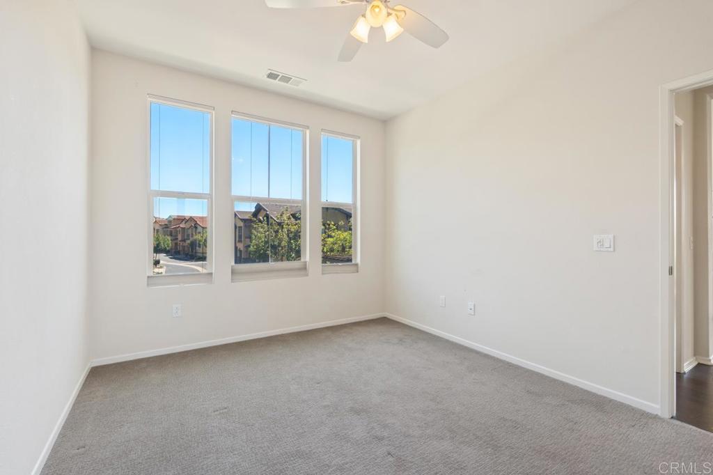 6610 Canopy Ridge Lane, Unit 37 San Diego, CA 92121 - Photo 43 of 65 an empty room with windows
