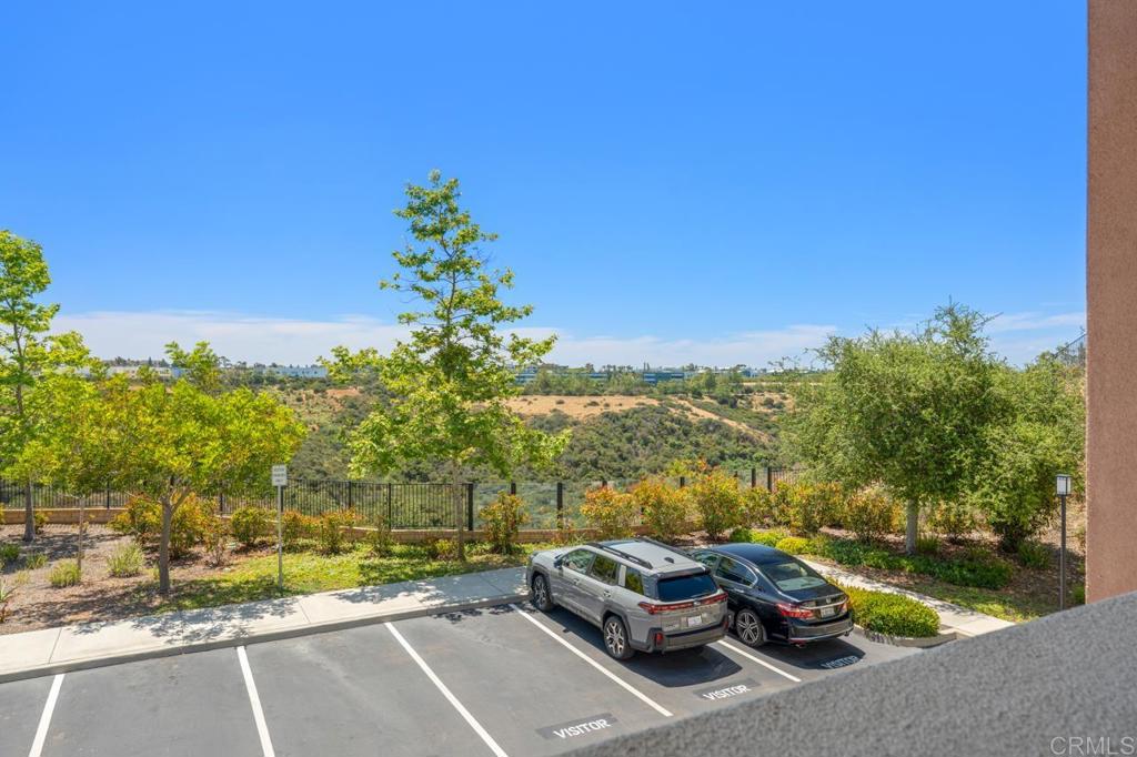 6610 Canopy Ridge Lane, Unit 37 San Diego, CA 92121 - Photo 49 of 65 a car parked on the side of a road