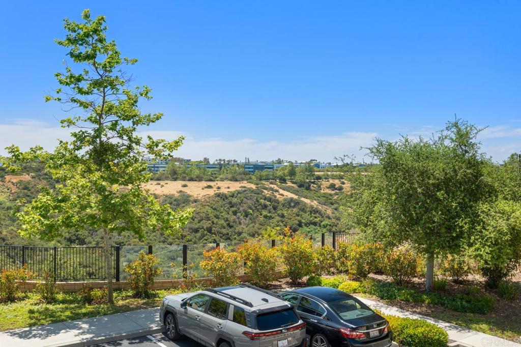 6610 Canopy Ridge Lane, Unit 37 San Diego, CA 92121 - Photo 50 of 65 a car parked on the side of a road